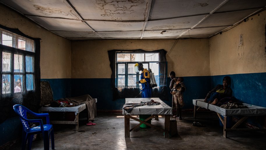 An MSF team member disinfects the room where patients are treated for cholera at the Sake referral health center supported by MSF as part of its emergency response