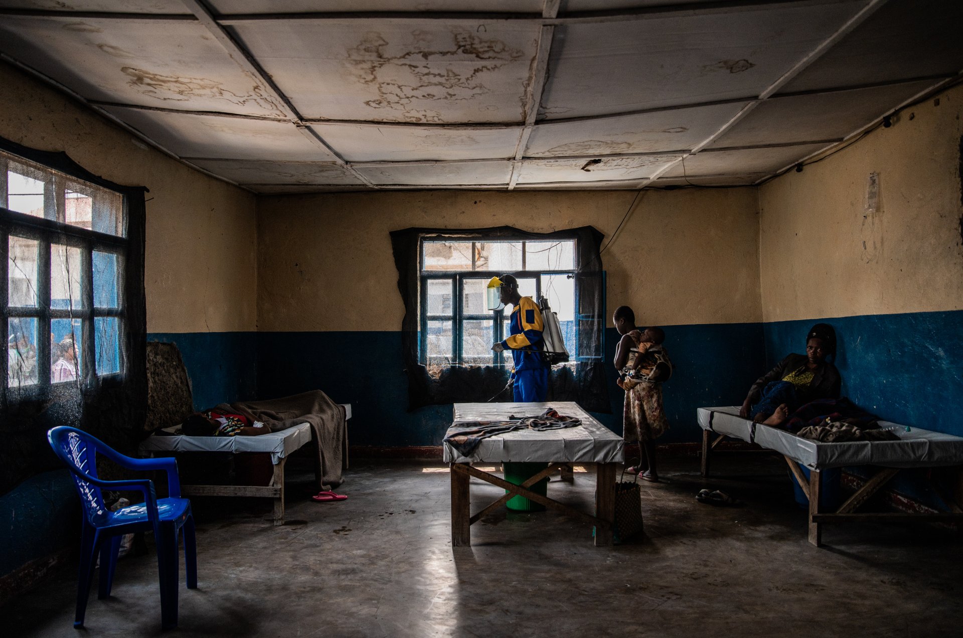 An MSF team member disinfects the room where patients are treated for cholera at the Sake referral health center supported by MSF as part of its emergency response